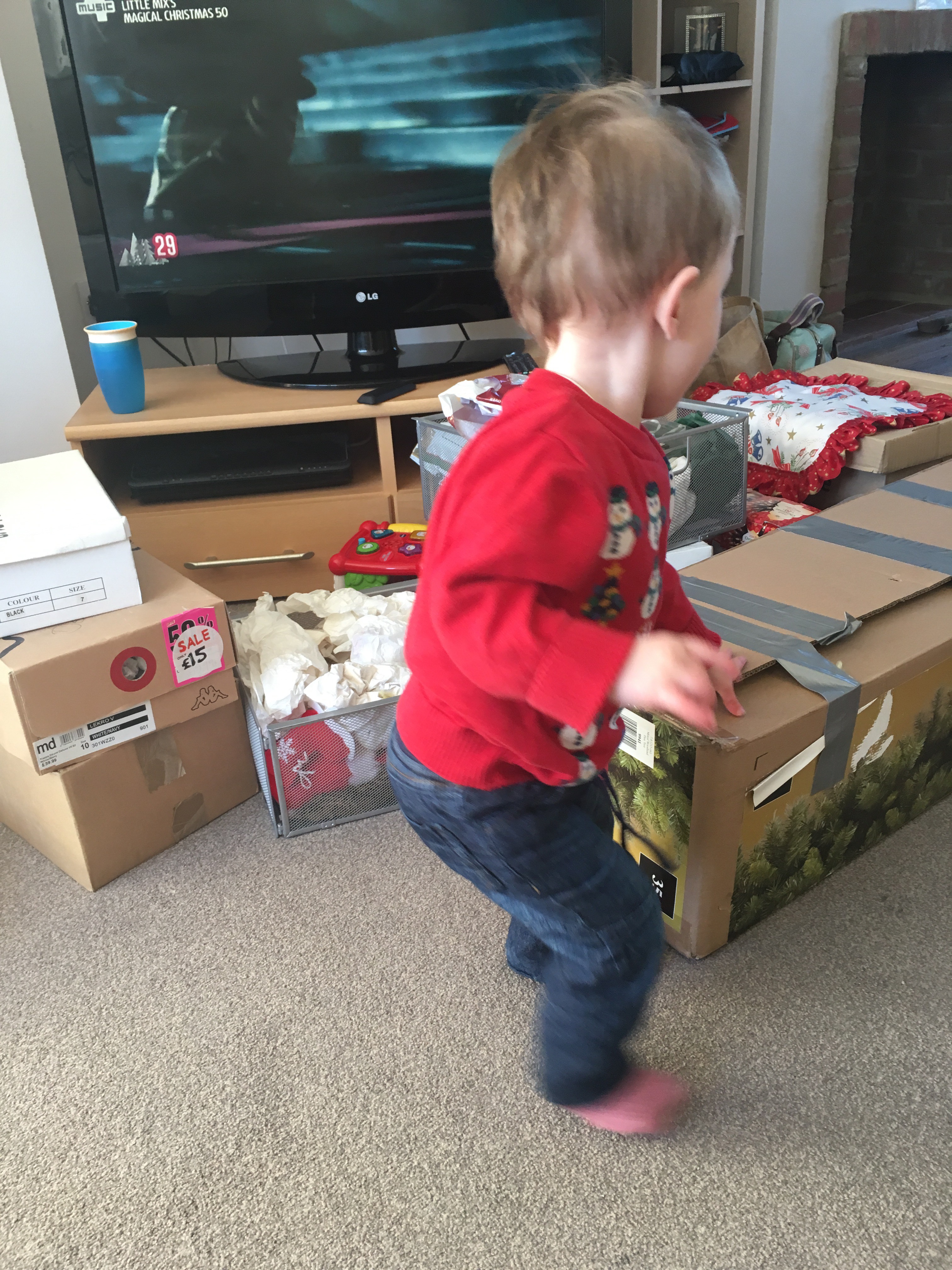 Toddler and boxes.