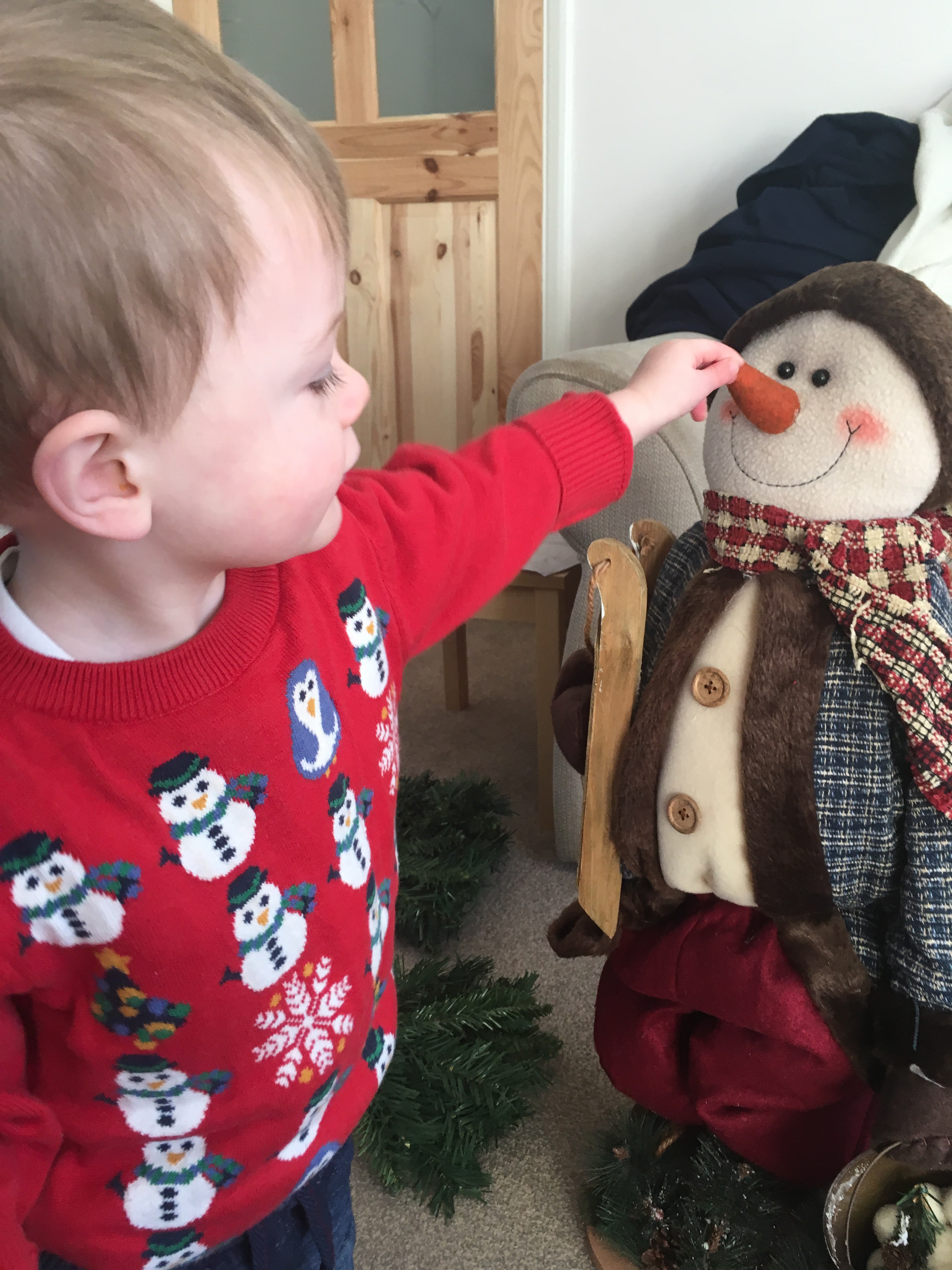 Toddler and snowman.